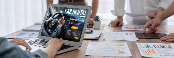 car rental website on computer screen for tourist to rent a car for transportation brisk