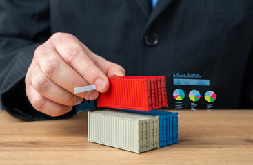 Man stacking sea containers. Concept of trade and transport logistics. Shipping. Import and export....
