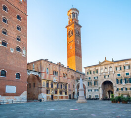 Fototapeta premium Verona old town square Piazza dei Signori with Dante Alighieri statue, Lamberti tower and Palazzo della Ragione with nobody, Veneto, Italy. Italian square with classic architecture