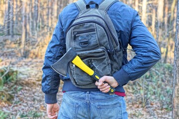 one small sharp iron black dangerous modern with plastic yellow handle industrial hatchet in hand...