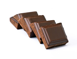 Dark chocolate bars arranged neatly on a white background for dessert lovers