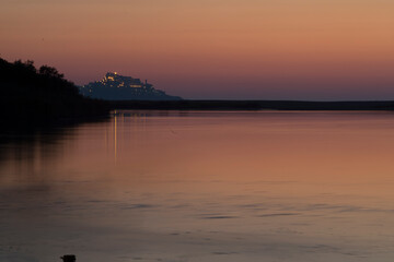 Naklejka premium sunset over the river, Mouth of the Coghinas river in Valledoria, a few kilometers from Castelsardo. Sassari, Sardinia. Italy