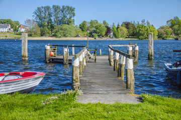 Wooden pier stretching into a serene lake