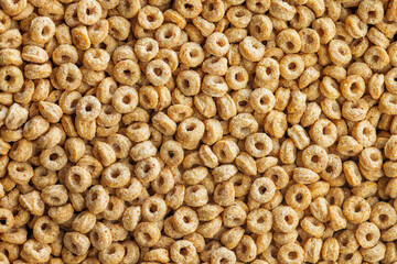 A lot of sweet honey cereal rings. Top view.