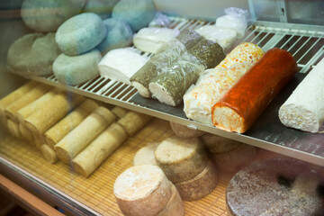 Delicious goat cheese on the supermarket showcase. High quality photo