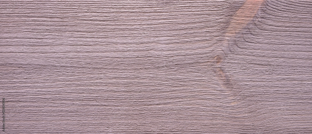 Aufkleber a red wooden surface with a grainy texture. the wood is a light color and has a slightly rough feel