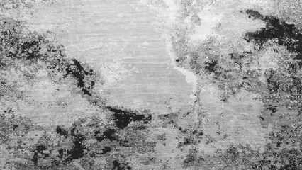 A black and white  texture  wall with a grey background. The wall has a lot of texture and he is...