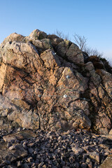 Brittle rock formation secured by bilts and wires.