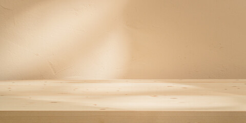 Warm beige minimalist backdrop, stucco wall,  with subtle light patterns, suitable for creative design templates.