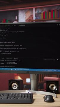 Vertical video Programming language code editor software displayed on PC screen in home workspace, illustrating technology driven collaboration and highlighting lines of code powering diverse digital