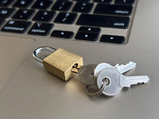 Safer Internet Day: Secure laptop with metal padlock and keys on keyboard