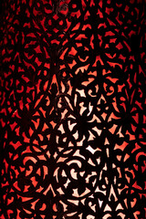 Detailed Brass Lamp with Red and Orange Hues