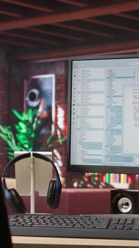Vertical video Software development and coding being done on PC, implementing algorithms. Code editor on computer screen in home office used for building applications and optimizing performance