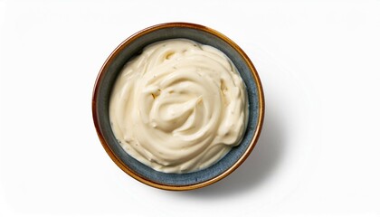 a bowl of alfredo sauce top view isolated on white background