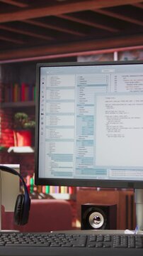 Vertical video Programming code on PC display used for developing software programs. Binary script on computer at home used for fixing errors in applications and implementing new features, jib up shot
