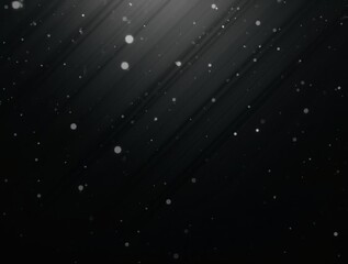 Fototapeta premium Subtle, diffused light illuminates tiny particles suspended in the dark.