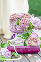 still life with a bouquet of half-withered ash-lilac Novalis roses, with a cup of refreshing cold tea on a summer day,