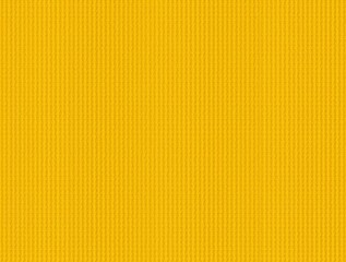 Close-up view of a uniform yellow fabric with subtle vertical lines.