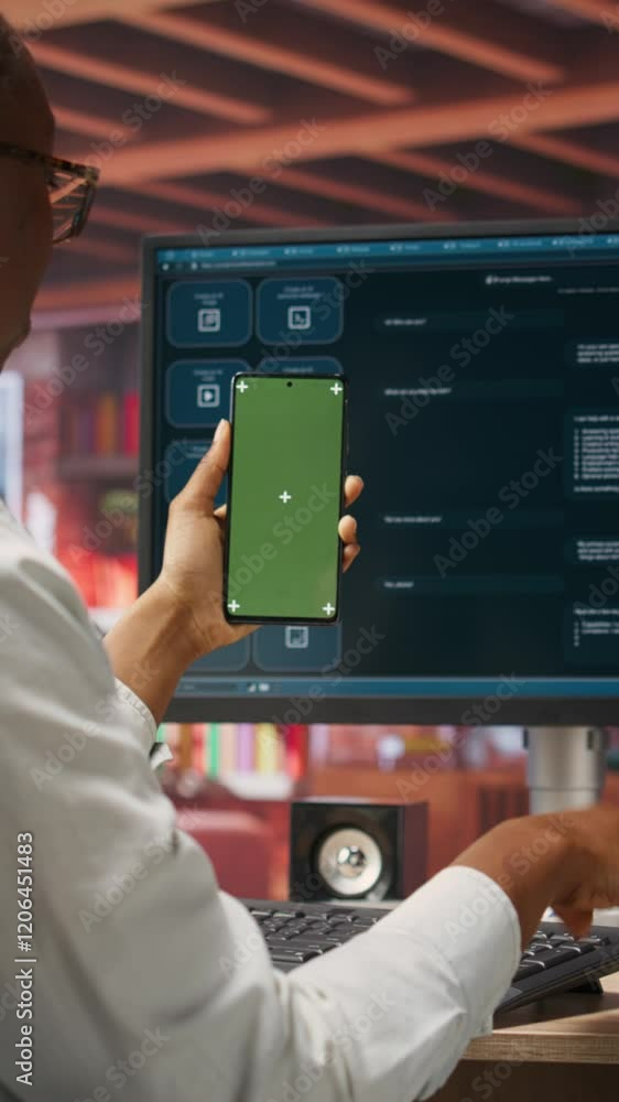 Poster vertical video woman seated at desk using ai llm chatbot software and green screen phone in modern u