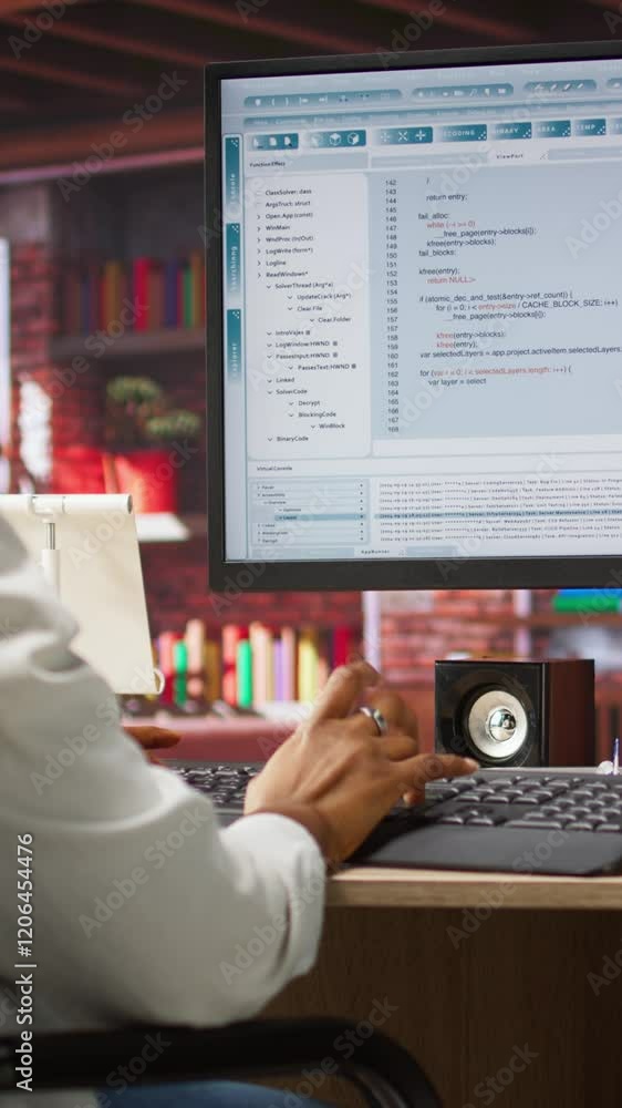 Poster vertical video programmer wearing headphones types code into pc, developing software programs, enter