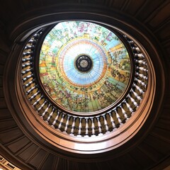 Elegant Spiral Staircase with Stunning Stained Glass Dome Ceiling