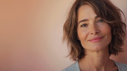 Fototapeta premium Portrait of a beautiful woman against a pink background 