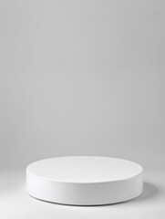 White round pedestal on light grey background.