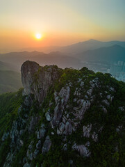 Vertical aerial view of Lion Rock Hill in Hong Kong at sunset