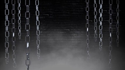 Swinging Chains in the Dark 4K Loop features metallic chains hanging down and swinging in a dark room with a brick wall in back and smoke rising in a loop.