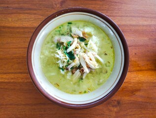 “Kare Ayam”, typical of Surakarta and surrounding areas, with rice and shredded chicken. The...