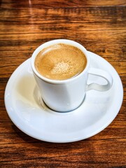 Cup of espresso on a wooden table