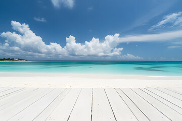 Fototapeta premium Landscape empty white wooden floor or table with sea waves hitting shore. Summer sea blue and white beach, rocks, Cloudy sky with bright sunlight is background. Interior display show products. 