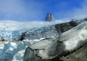  a steep rock spire in the sermeq glacier at the end of the tasermuit fjord on a sunny summer day near nanortalik, in southern greenland © Nina