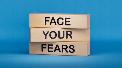 Face your Fears symbol. Wooden blocks with words Face your Fears.Business and Face your Fears. Copy space.3D rendering on blue background.