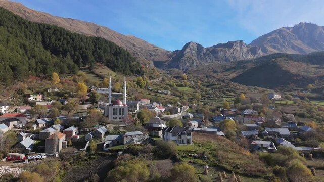 Aerial Overview of Radomire, Albania with the Majestic Korab Range