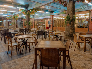 Canteen with wooden chairs and tables