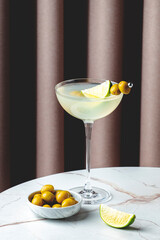 Mexican martini, alcoholic cocktail drink with tequila, liqueur, lime juice and green olives....