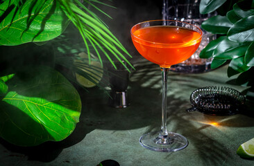 Naked and Famous, alcoholic cocktail drink with mezcal, orange bitters, yellow liqueur and lime...