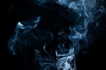 Smoke from flames or fog clouds graphic design art isolated on dark black background.