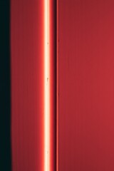 Red light illuminates a textured wall.