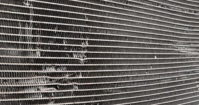 car radiator damaged after an accident, a radiator damaged in an accident to cool the car during engine operation