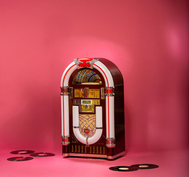 vintage jukebox on pink background