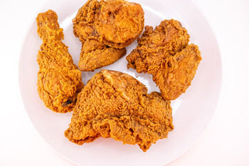 Crispy Golden Fried Chicken Pieces on White
