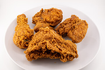 Crispy Golden Fried Chicken Pieces on White