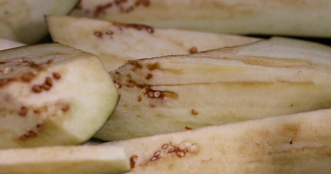 cut lengthwise ripe eggplant during cooking, the flesh and seeds of sliced ripe eggplant