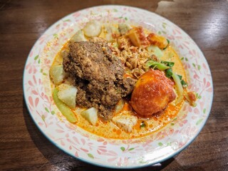 Rice cakes and chicken rendang