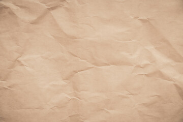 close-up of crumpled brown paper, revealing a texture reminiscent of aged parchment