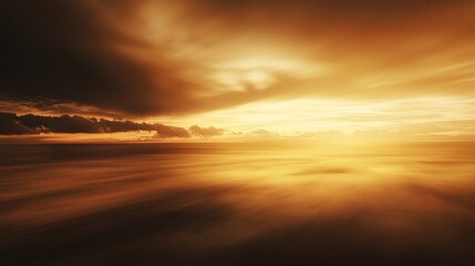 Obraz premium Golden Hour Seascape: A Dramatic Sunset over a Calm Ocean