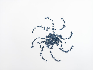 Navy masterbatch plastic granules, hot cutting type, colorful polymer pigment granules isolated on...