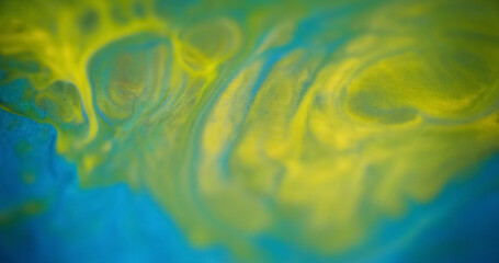 Blur paint splash. Mist swirl. Defocused blue yellow green color smoke texture ink blend spreading swirl abstract art background.